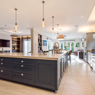 Example of a large transitional l-shaped marble floor and beige floor open concept kitchen design in Berkshire with an undermount sink, shaker cabinets, stainless steel appliances, gray cabinets, quartzite countertops, blue backsplash, marble backsplash, an island and white countertops