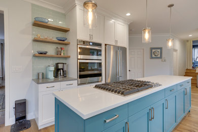 Inspiration for a transitional kitchen remodel in Portland with shaker cabinets and an island