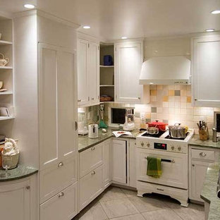 Inspiration for a small beach style u-shaped separate kitchen in Chicago with a double-bowl sink, recessed-panel cabinets, white cabinets, laminate benchtops, beige splashback, ceramic splashback, white appliances, porcelain floors, no island and beige floor.