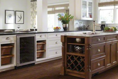 Inspiration for a craftsman medium tone wood floor kitchen remodel in Little Rock with an island
