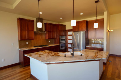 Inspiration for a mid-sized timeless l-shaped medium tone wood floor kitchen remodel in Denver with an island