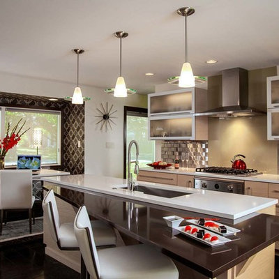 Example of a small trendy galley ceramic tile eat-in kitchen design in Other with an undermount sink, flat-panel cabinets, light wood cabinets, metallic backsplash, metal backsplash, an island, quartz countertops and stainless steel appliances