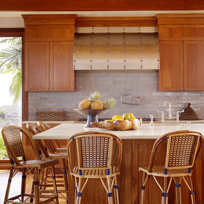 Eat-in kitchen - large tropical l-shaped medium tone wood floor eat-in kitchen idea in Hawaii with medium tone wood cabinets, gray backsplash, subway tile backsplash, an undermount sink, recessed-panel cabinets, marble countertops and an island
