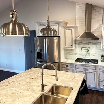 Hazelwood Homes- White Kitchen With Accent Glaze and Black Island