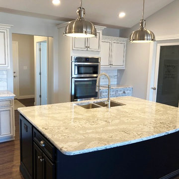 Hazelwood Homes- White Kitchen With Accent Glaze and Black Island