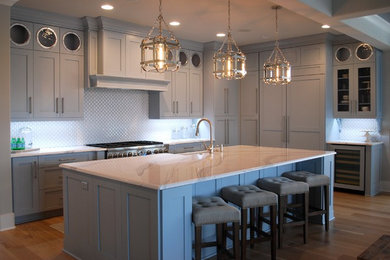 Example of a beach style kitchen design in Wilmington with shaker cabinets