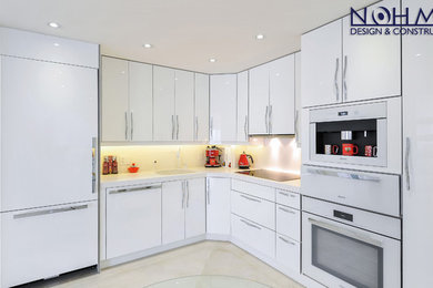 Eat-in kitchen - mid-sized transitional galley porcelain tile eat-in kitchen idea in Miami with a drop-in sink, recessed-panel cabinets, white cabinets, granite countertops, white backsplash, ceramic backsplash, white appliances and an island