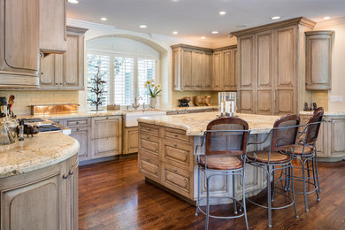 Example of a mid-sized classic u-shaped dark wood floor open concept kitchen design in Kansas City with an undermount sink, raised-panel cabinets, gray cabinets, granite countertops, yellow backsplash, subway tile backsplash, stainless steel appliances and no island