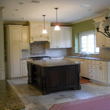 Hi low cabinets add hieght and interest to this kitchen.