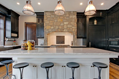 Example of a mountain style kitchen design in Calgary