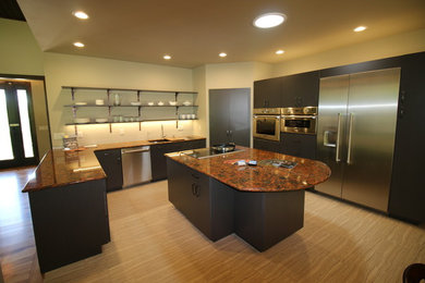 Example of a mid-sized minimalist u-shaped porcelain tile enclosed kitchen design in Other with an undermount sink, flat-panel cabinets, dark wood cabinets, granite countertops, white backsplash, stainless steel appliances and an island