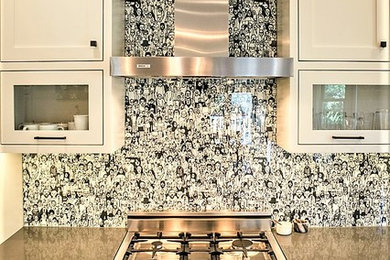 Inspiration for a large eclectic l-shaped dark wood floor eat-in kitchen remodel in San Francisco with an undermount sink, shaker cabinets, white cabinets, quartzite countertops, white backsplash, glass sheet backsplash, stainless steel appliances and an island