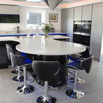 High Gloss Black and White Kitchen with Dramatic Lighting