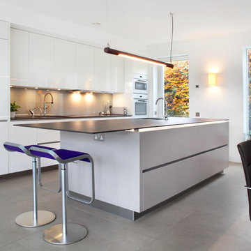 High gloss grey & white kitchen with large island