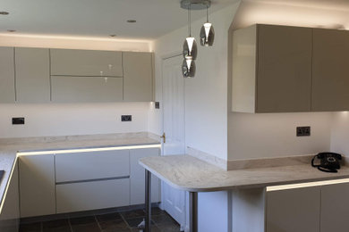 High gloss modern style handleless kitchen.