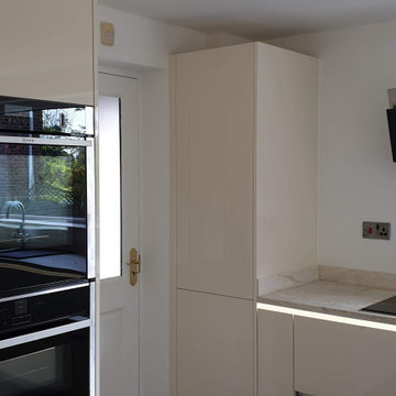 High gloss modern style handleless kitchen.