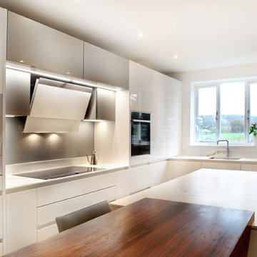 High gloss white & grey contemporary kitchen with built in storage