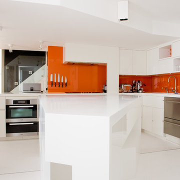 High-gloss white kitchen with Hi-Macs.