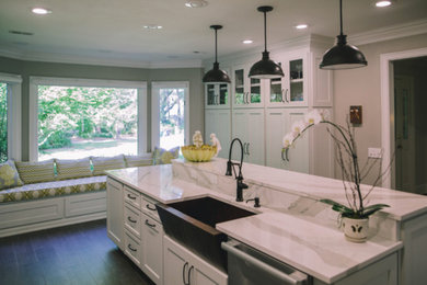 Inspiration for a transitional porcelain tile kitchen remodel in Atlanta with a single-bowl sink, shaker cabinets, gray cabinets, quartz countertops, multicolored backsplash, glass sheet backsplash, stainless steel appliances and an island