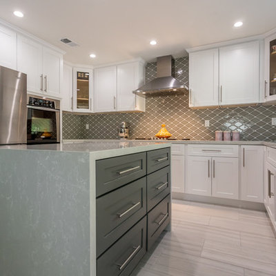 Large transitional u-shaped porcelain tile open concept kitchen photo in Los Angeles with a single-bowl sink, shaker cabinets, white cabinets, quartzite countertops, gray backsplash, porcelain backsplash, stainless steel appliances and an island