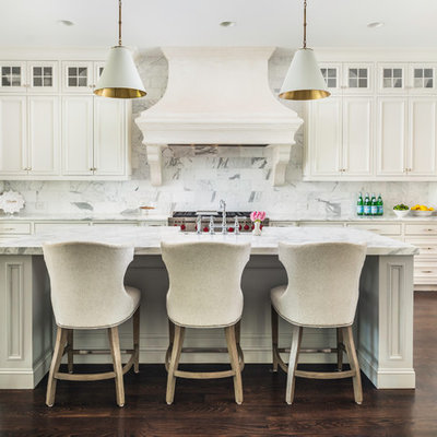 Inspiration for a timeless dark wood floor and brown floor kitchen remodel in Nashville with recessed-panel cabinets, white cabinets, white backsplash, stainless steel appliances, an island and white countertops
