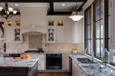 Large elegant dark wood floor and brown floor eat-in kitchen photo in Atlanta with an undermount sink, beaded inset cabinets, white cabinets, granite countertops, white backsplash, ceramic backsplash, stainless steel appliances, an island and gray countertops