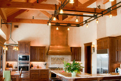 Example of a classic medium tone wood floor open concept kitchen design in Austin with dark wood cabinets, beige backsplash, stone tile backsplash, an island and granite countertops