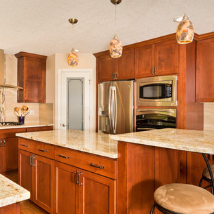 Mid-sized contemporary open concept kitchen designs - Inspiration for a mid-sized contemporary u-shaped medium tone wood floor open concept kitchen remodel in Portland with an undermount sink, recessed-panel cabinets, medium tone wood cabinets, granite countertops, beige backsplash, glass tile backsplash, stainless steel appliances and an island
