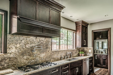 Large elegant galley dark wood floor eat-in kitchen photo in Indianapolis with a double-bowl sink, shaker cabinets, dark wood cabinets, granite countertops, beige backsplash, stone slab backsplash, stainless steel appliances and no island