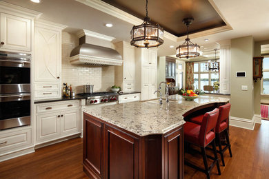 Eat-in kitchen - large traditional single-wall dark wood floor eat-in kitchen idea in Minneapolis with a double-bowl sink, beaded inset cabinets, white cabinets, quartz countertops, white backsplash, stainless steel appliances and an island