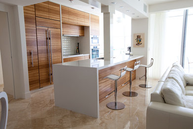 Kitchen - contemporary kitchen idea in Charleston with flat-panel cabinets, medium tone wood cabinets and gray backsplash