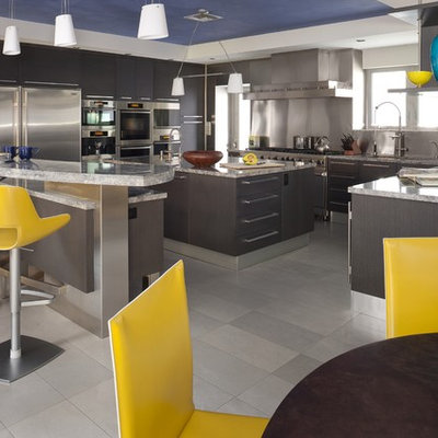 Example of a trendy kitchen design in Miami with granite countertops and stainless steel appliances