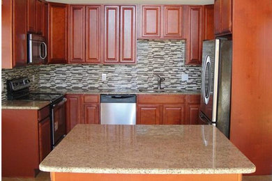 Kitchen - traditional l-shaped ceramic tile kitchen idea in Miami with a double-bowl sink, raised-panel cabinets, brown cabinets, granite countertops and an island