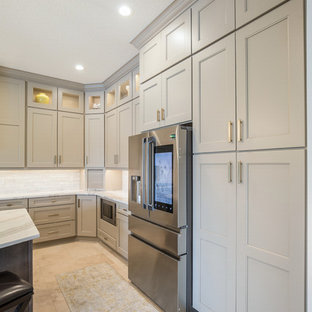 Inspiration for a mid-sized l-shaped kitchen pantry in Jacksonville with an undermount sink, recessed-panel cabinets, brown cabinets, quartz benchtops, white splashback, marble splashback, stainless steel appliances, ceramic floors, with island, multi-coloured floor and white benchtop.