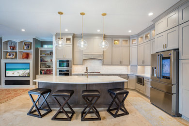 Mid-sized l-shaped ceramic tile and multicolored floor kitchen pantry photo in Jacksonville with an undermount sink, recessed-panel cabinets, brown cabinets, quartz countertops, white backsplash, marble backsplash, stainless steel appliances, an island and white countertops