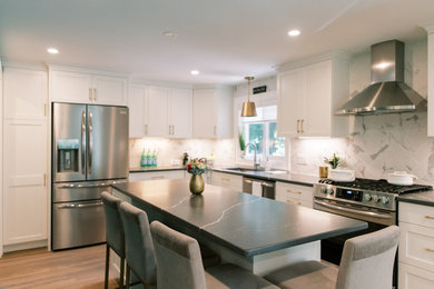 Eat-in kitchen - large contemporary l-shaped eat-in kitchen idea in Boston with white cabinets, granite countertops, white backsplash, stainless steel appliances, an island and gray countertops