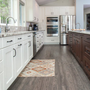 Transitional kitchen designs - Inspiration for a transitional kitchen remodel in Seattle with recessed-panel cabinets and an island