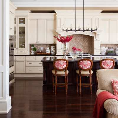Elegant brown floor open concept kitchen photo in Toronto with stainless steel appliances, recessed-panel cabinets, beige cabinets, brown backsplash, mosaic tile backsplash and brown countertops
