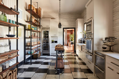 Elegant eat-in kitchen photo in San Francisco with an island