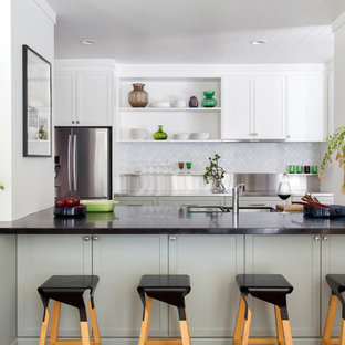Inspiration for a transitional u-shaped kitchen in Perth with shaker cabinets, stainless steel benchtops, an undermount sink, grey cabinets, grey splashback, stainless steel appliances, no island and black benchtop.