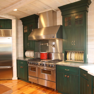 Large country u-shaped separate kitchen in Other with an undermount sink, louvered cabinets, green cabinets, wood benchtops, beige splashback, stainless steel appliances, dark hardwood floors and with island.