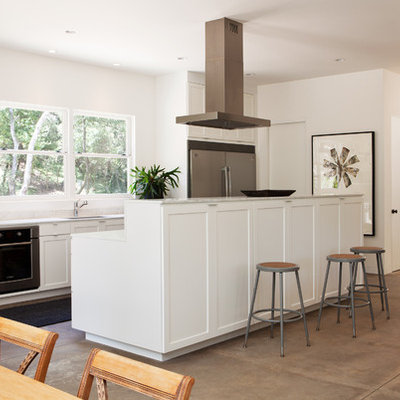 Eat-in kitchen - transitional galley eat-in kitchen idea in San Francisco with stainless steel appliances, recessed-panel cabinets and white cabinets