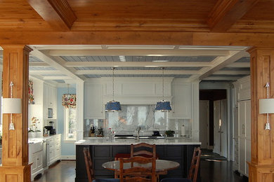 Example of a large trendy dark wood floor eat-in kitchen design in Chicago with white cabinets, marble countertops, paneled appliances, an island, white backsplash, stone slab backsplash, a farmhouse sink and flat-panel cabinets