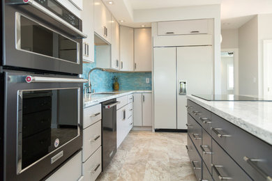 Eat-in kitchen - mid-sized modern u-shaped ceramic tile and beige floor eat-in kitchen idea in Hawaii with an undermount sink, flat-panel cabinets, gray cabinets, granite countertops, blue backsplash, glass tile backsplash, stainless steel appliances and white countertops