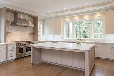 Example of a transitional kitchen design in Boston with flat-panel cabinets, white cabinets and stainless steel appliances