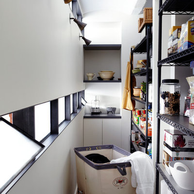 Inspiration for a contemporary kitchen remodel in New York with open cabinets, black cabinets and white backsplash