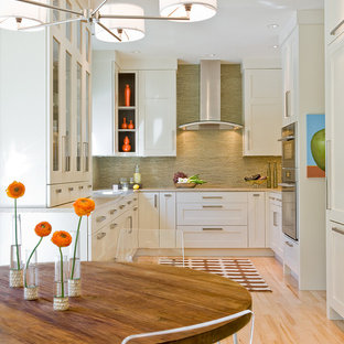 Transitional eat-in kitchen ideas - Eat-in kitchen - transitional u-shaped eat-in kitchen idea in Boston with shaker cabinets, paneled appliances, white cabinets, green backsplash and matchstick tile backsplash