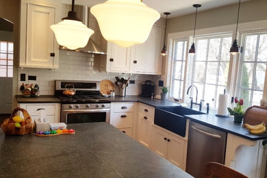 Example of an arts and crafts kitchen design in Chicago with an island