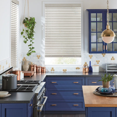 Inspiration for a mid-sized transitional l-shaped gray floor kitchen remodel in New York with shaker cabinets, blue cabinets, multicolored backsplash, stainless steel appliances, an island, quartz countertops, porcelain backsplash and black countertops