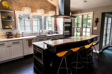 Eat-in kitchen - mid-sized contemporary l-shaped ceramic tile and gray floor eat-in kitchen idea in Wichita with white cabinets, white backsplash, stainless steel appliances, an island, an undermount sink, raised-panel cabinets, marble countertops and stone tile backsplash